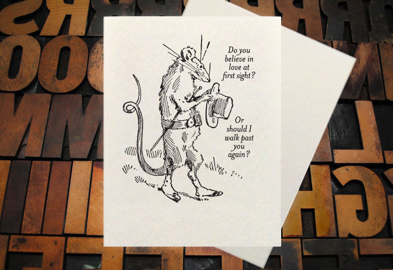 Letterpress Card with the text, "I -heart shape- you more than bacon" over an image of a strip of bacon